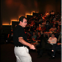 Dave Presenting in an Auditorium